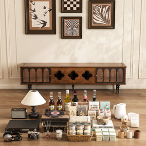 Wooden tv stand with decorative items on a wooden floor