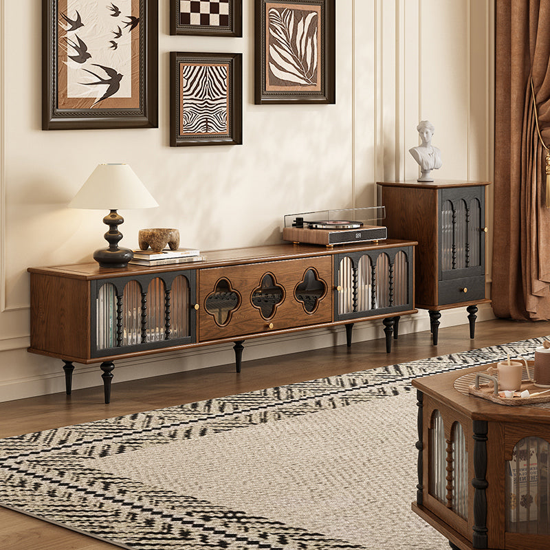 Wooden entertainment console with decorative items in a living room setting
